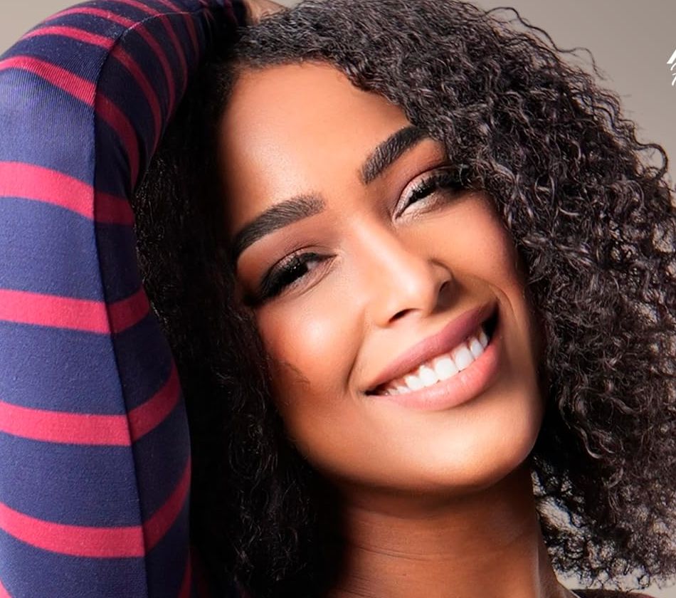 Smiling woman with voluminous curls