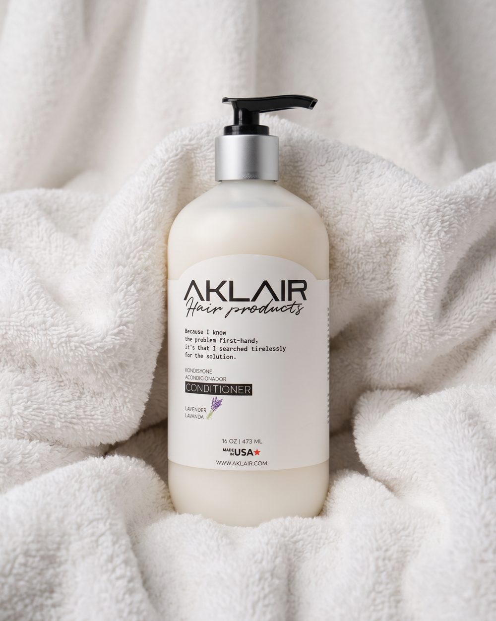 AKLAIR Curl Conditioner on a soft white towel